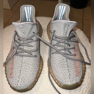 Women’s Yeezys Gray with a hint of neon orange.